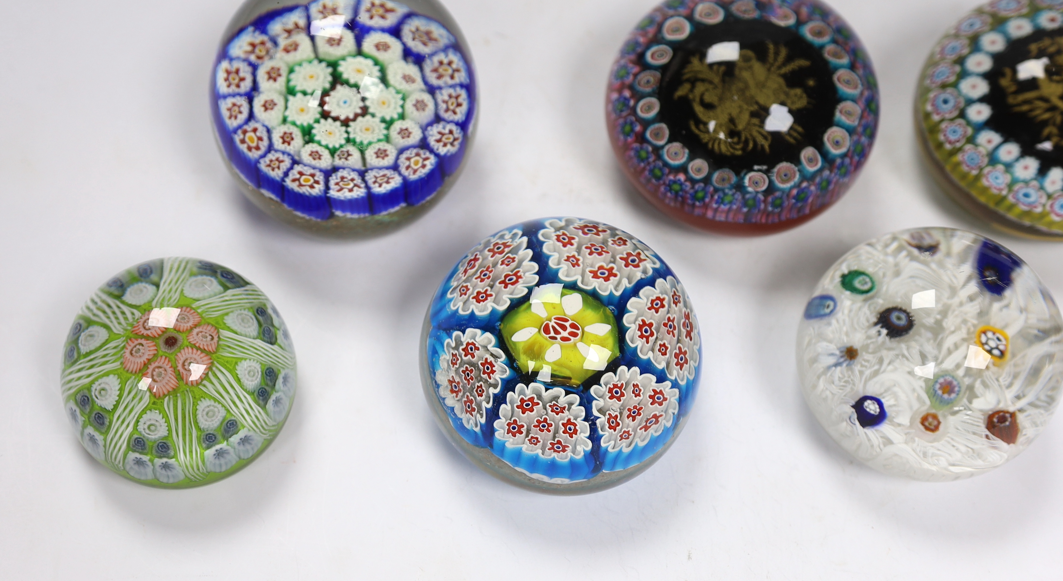 Seven various glass millefiori paperweights, Murano etc.